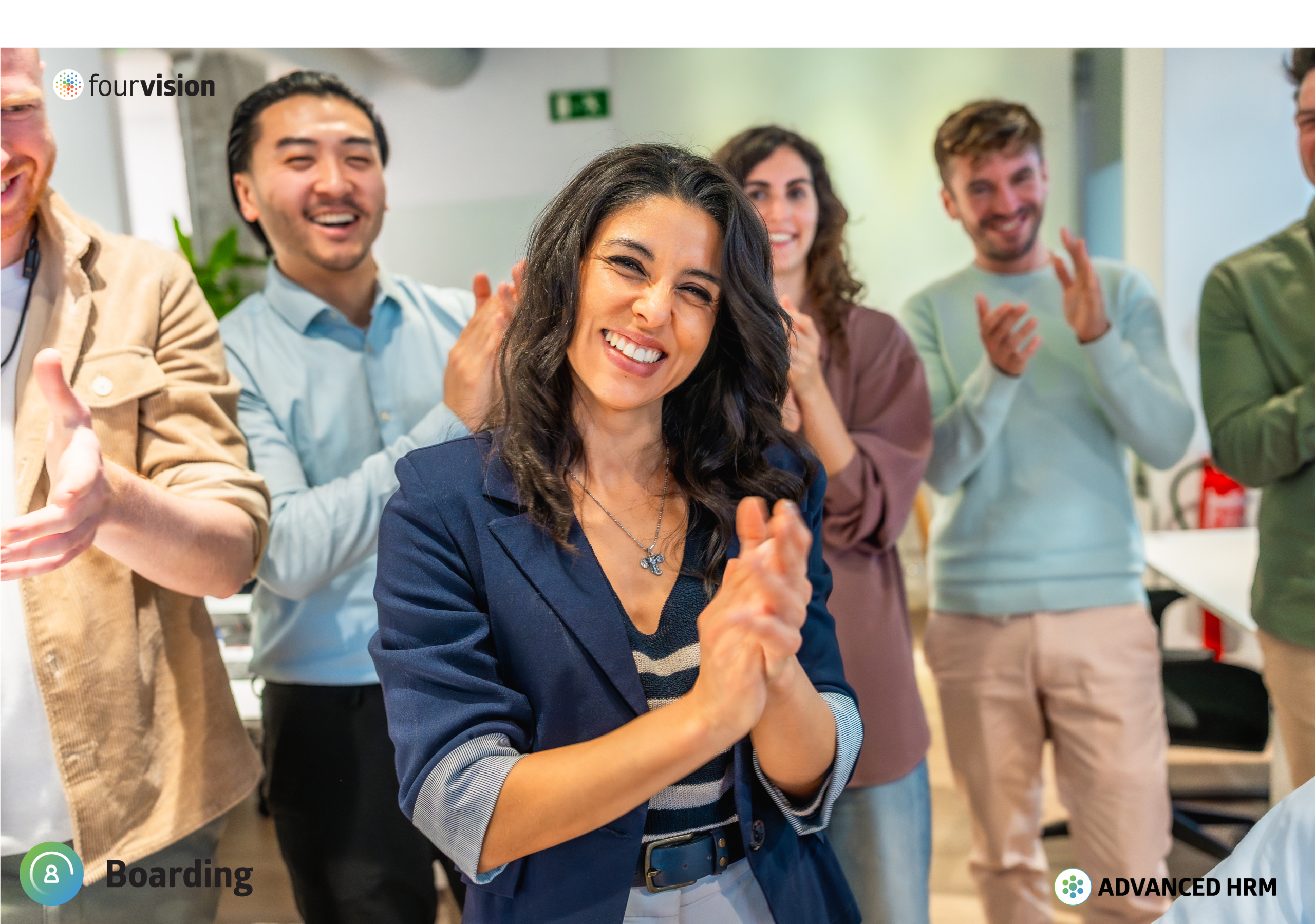 Image of a happy woman clapping with colleagues behind her also clapping.